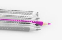 Photo of several grey pencils with one purple one